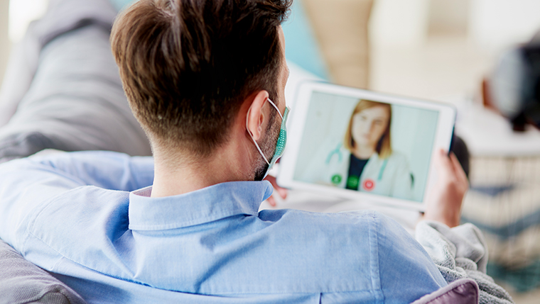 man-having-video-conference-with-a-doctor-4bzgypm