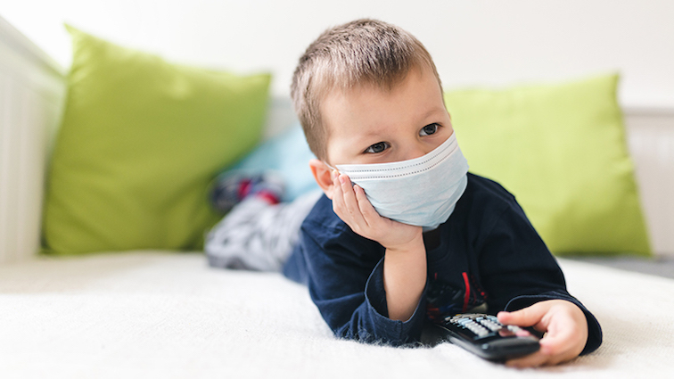 unhappy-child-wearing-respiratory-mask-as-preventi-66grdp6